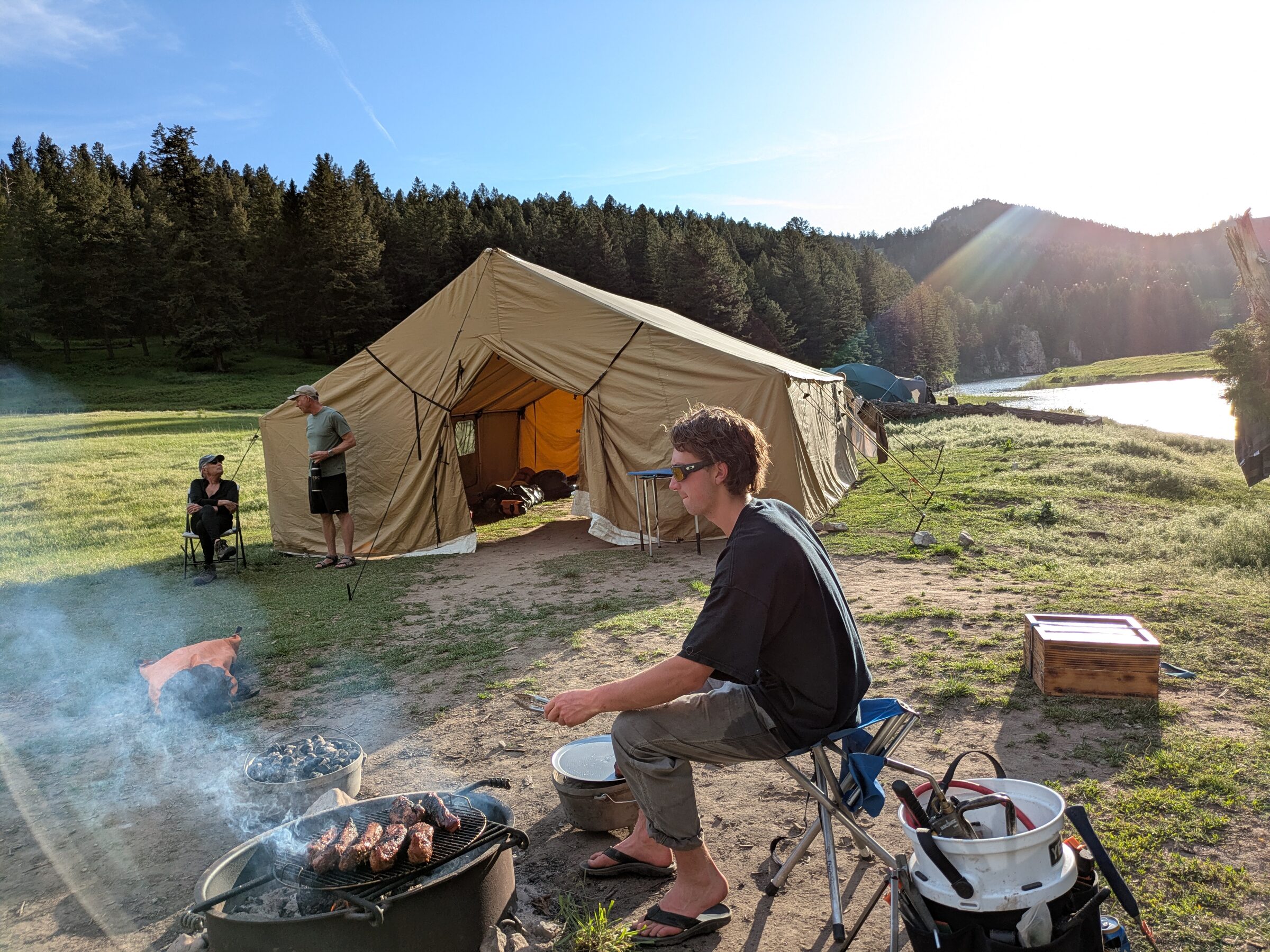 Dinner on the grill at camp in the evening light